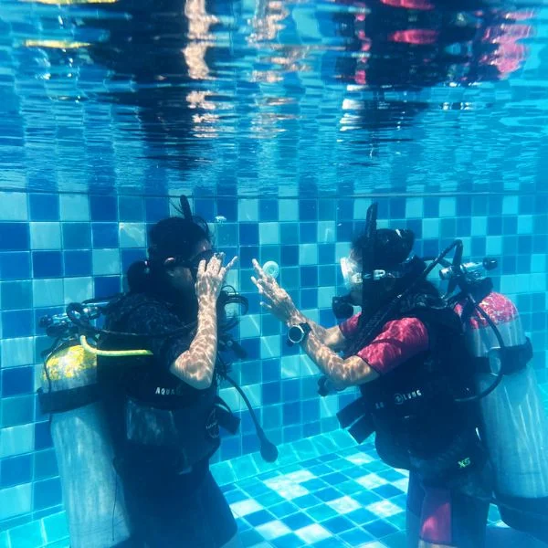 PADI Instructor teaching beginner divers essential underwater skills