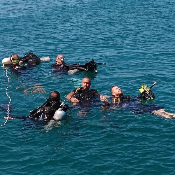 Instructor demonstrating rescue techniques in water