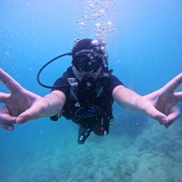 Instructor supervising first-time divers underwater