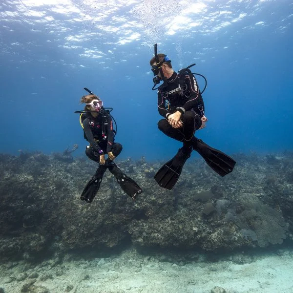 Instructor demonstrating buoyancy control techniques